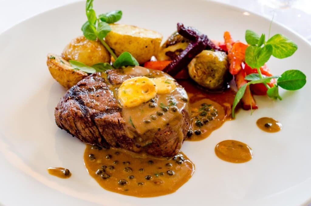 USDA Prime Angus beef tenderloin, peppercorn sauce & cafe de Paris butter