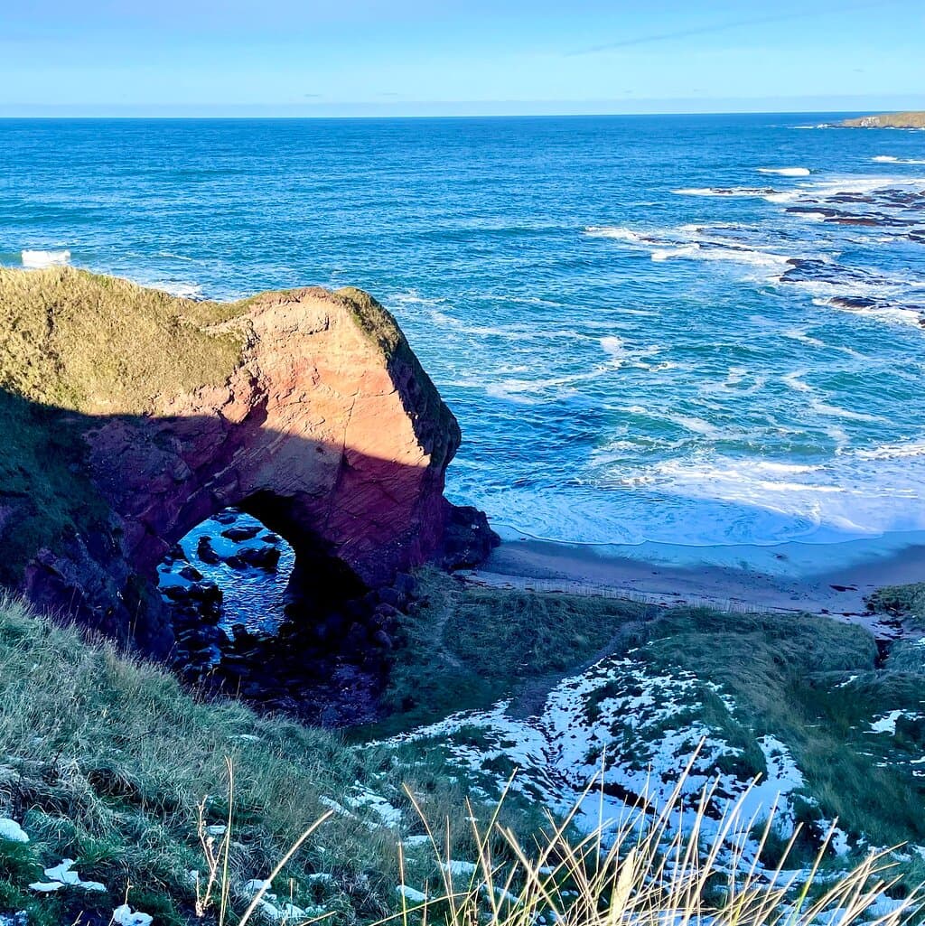 There are several accessible limestone sea-caves to explore - when the tide is out of course. The scramble up the steep hill path is worth it for the stunning views.