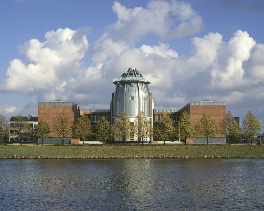 This is the riverside of the museum. The main entrance is actually on the opposite side, along the street. However, the zinc-covered tower or Cupola you see here is one of the main architectural features of the museum. 

Read more about the architecture on our website:
https://www.bonnefanten.nl/en/art-artists/explore-the-building/explore-the-building

Photo by Kim Zwarts