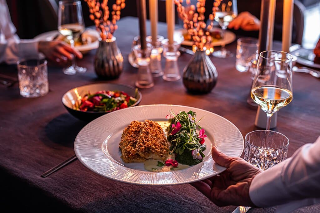 Almond-crusted trout fillet, barley in celery and coconut cream,  celery salad and beurre blanc sauce with celery oil 