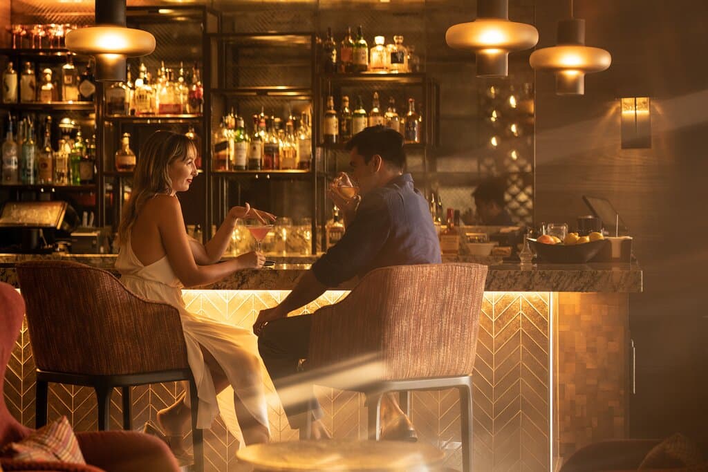 Take a seat at the bar where you can order artisan cocktails.