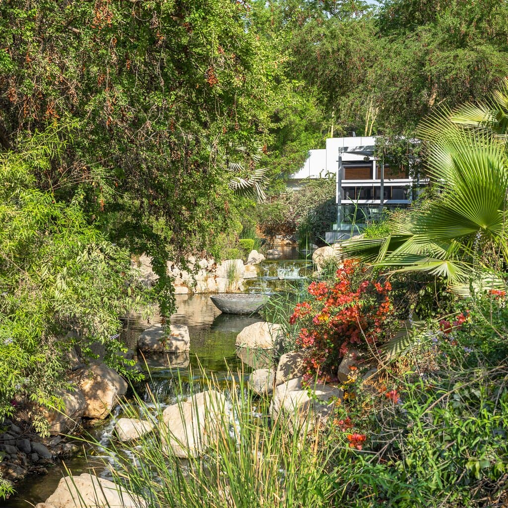 Modern restaurant for international and Thai cuisine on an estate with lakes, waterways and gardens.