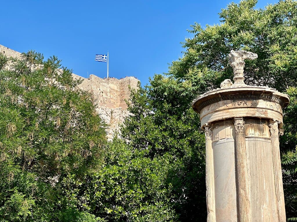 a small square in the heart of the Plaka area, under the shadow of the Parthenon (you can see the flag flying at the top of the Acropolis).
