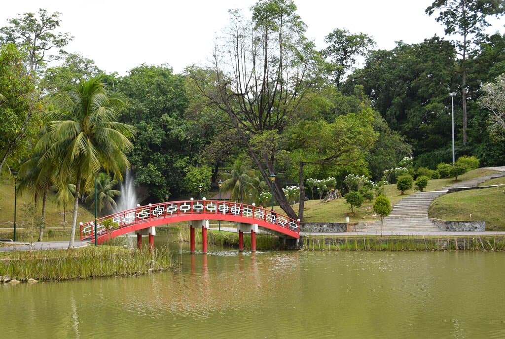 The ornate bridge over the lake  in Reservoir / Unity Park Kuching