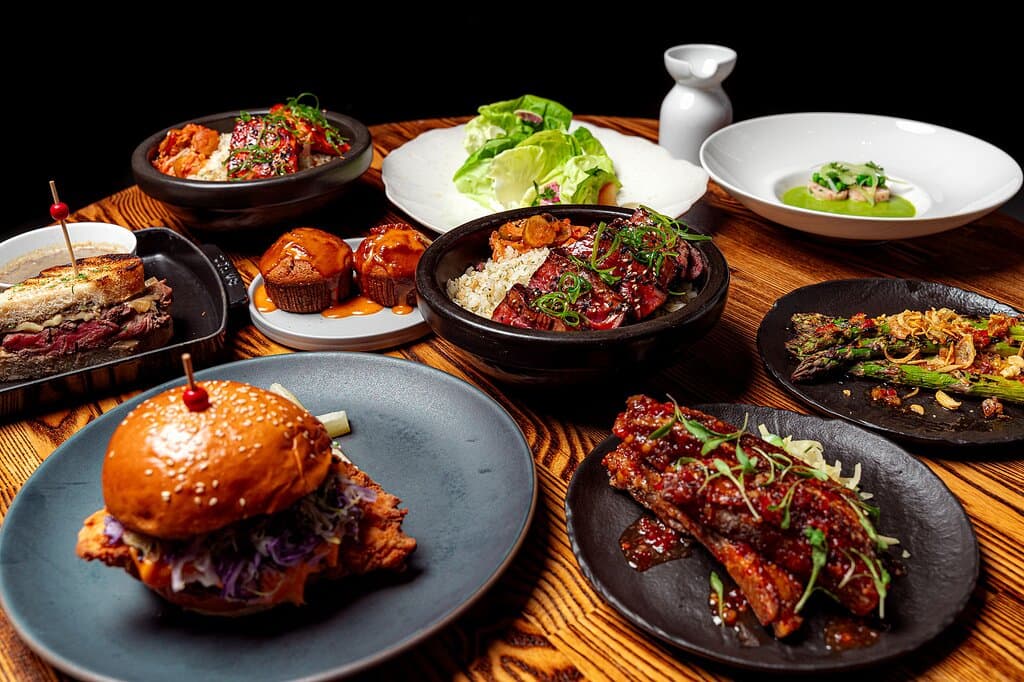 A spread of delicious dishes available for Lunch Monday through Thursday at International Smoke in San Francisco.