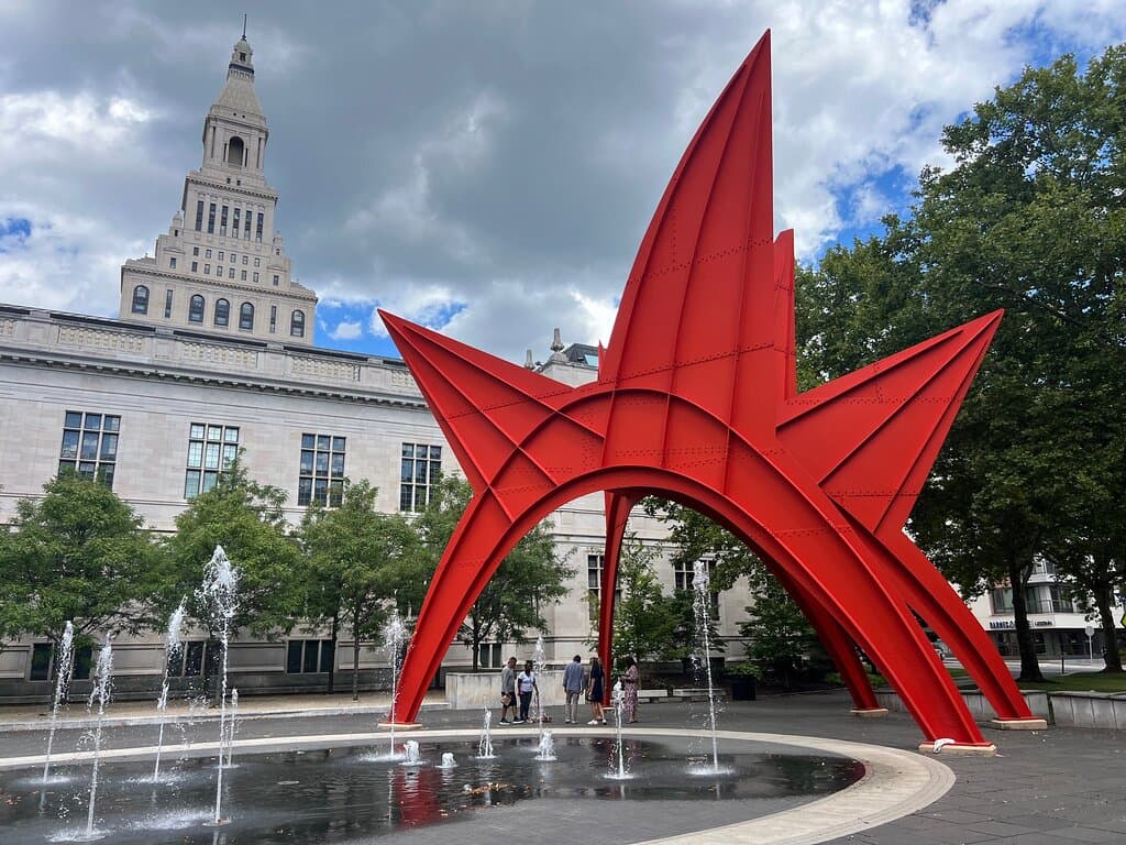 The sculpture in it plaza with the fountain