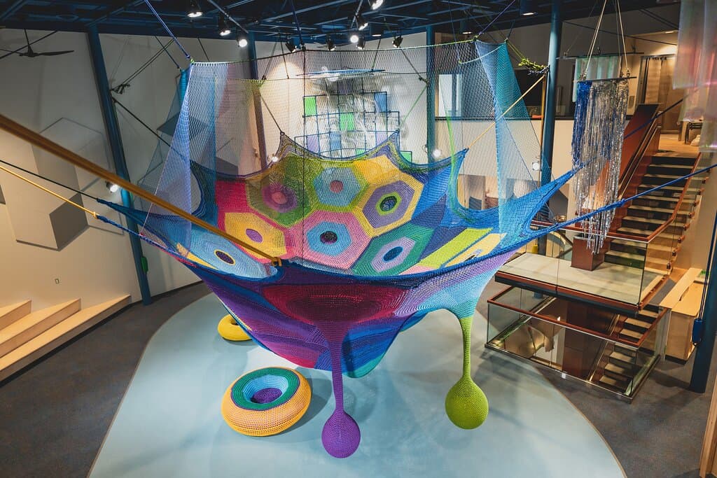Located in the North Gallery, Cosmic Commotion is a truly tactile experience. Kids can pop up through holes in the climbing structure’s web-like surface, or swing from dangling crocheted “pods.”  Nutrien Wonderhub is honoured to be the only facility in Canada and one of four in North America with a permanent installation from internationally-acclaimed artist Toshiko Horiuchi MacAdam.