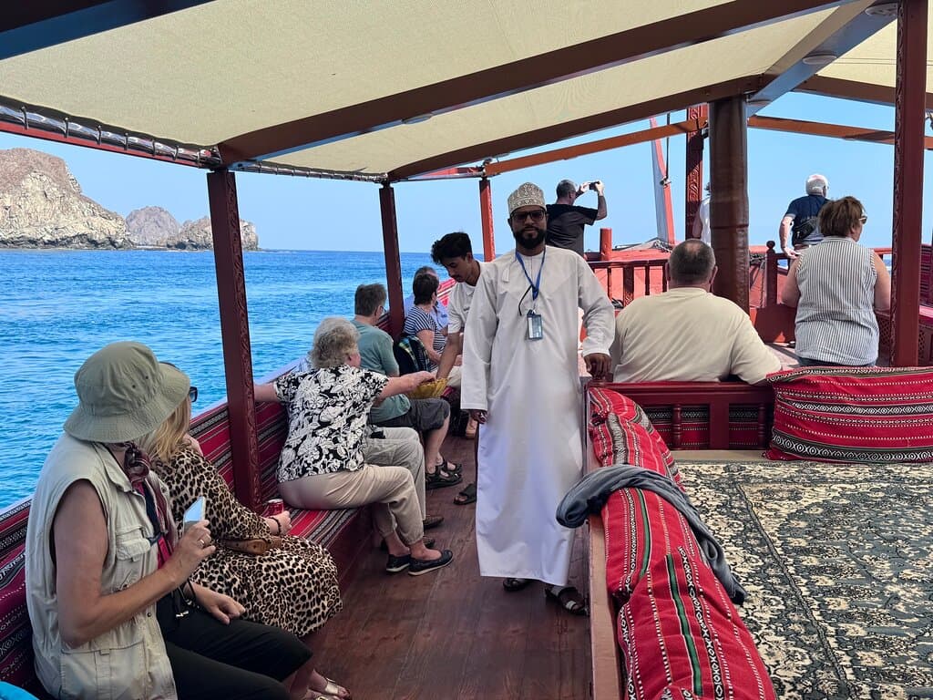 That sounds like an incredible adventure! Here's a creative and informative review of your trip on a dhow cruise ship:  ---  **Dhow Cruise Ship Experience**  **Review:** Our trip on the dhow cruise ship was an unforgettable experience that seamlessly blended tradition with modern comfort. From the moment we stepped on board, we were greeted with warm hospitality and a charming ambiance that set the tone for the entire journey.  The dhow itself was a beautiful vessel.