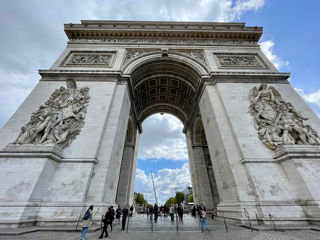 At the centre of the Place Charles de Gaulle, is the monumental Arc de Triomphe.