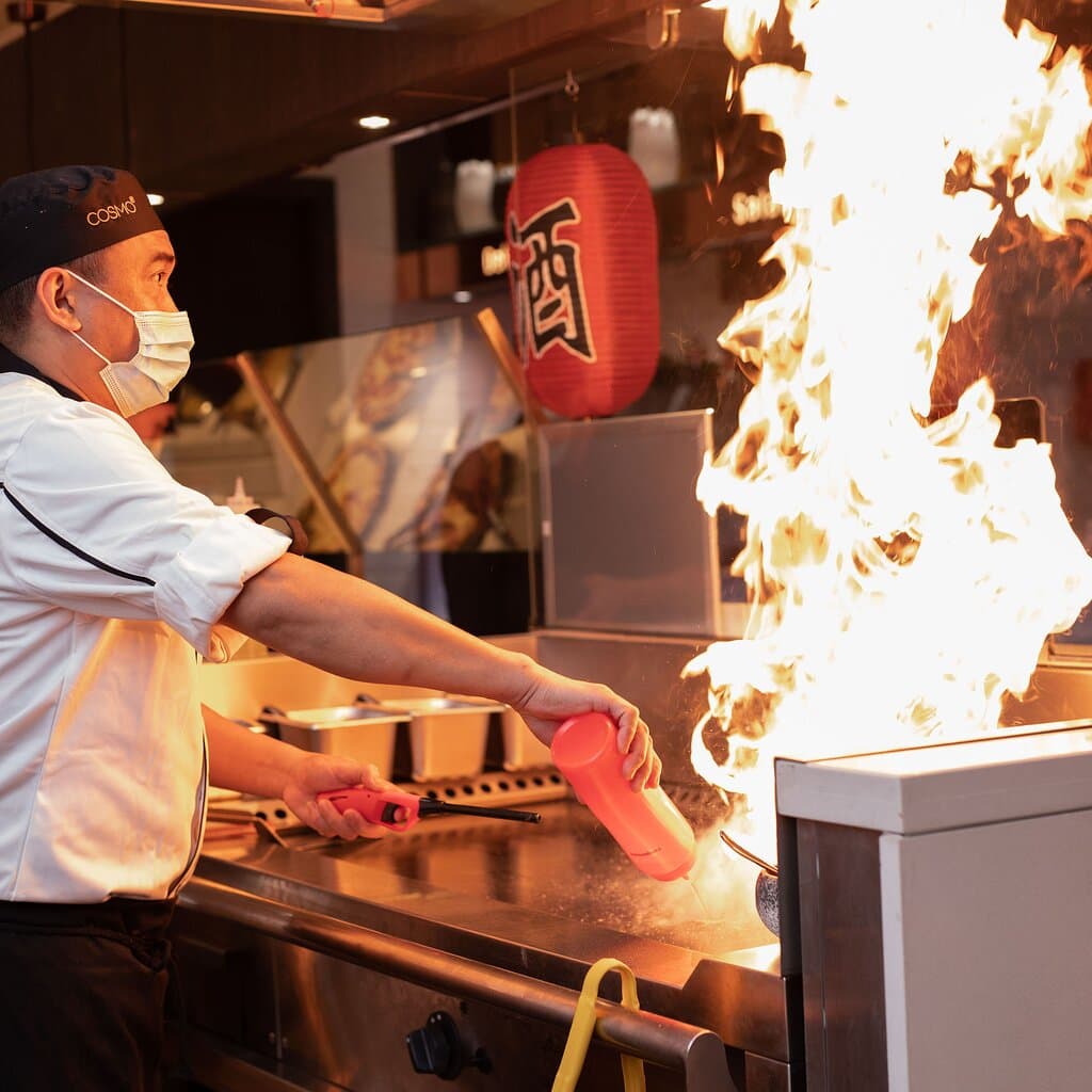 Watch the magic happen as skilled chefs grill meats, seafood, and vegetables to perfection on a sizzling hotplate—right before your eyes, with flair and flavour.