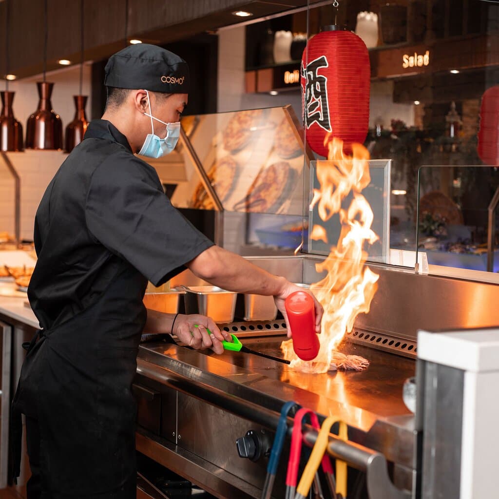Watch the magic happen as skilled chefs grill meats, seafood, and vegetables to perfection on a sizzling hotplate—right before your eyes, with flair and flavour.