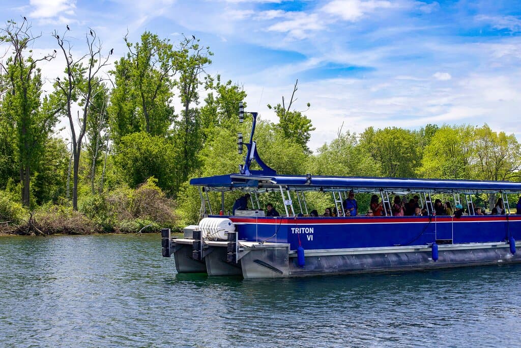 Triton VI, our main tour boat cruising through the serene Toronto Islands  