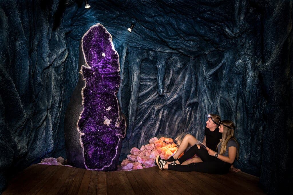 Sit quietly beneath the towering giant amethyst geode, surrounded by glowing rose quartz and textured man-made cave walls. With headlamps on and a guidebook in hand, take in the awe of the crystal-filled chamber. A moment of calm, curiosity, and connection inside The Crystal Caves. This is more than a museum, it’s an adventure in crystal dreaming...