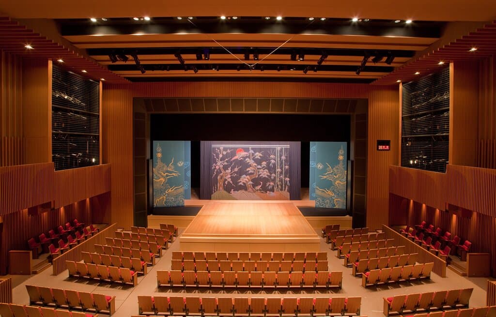 "National Theatre Okinawa's main stage. Experience authentic Kumiodori and Ryukyu dance, a true Okinawan cultural highlight."