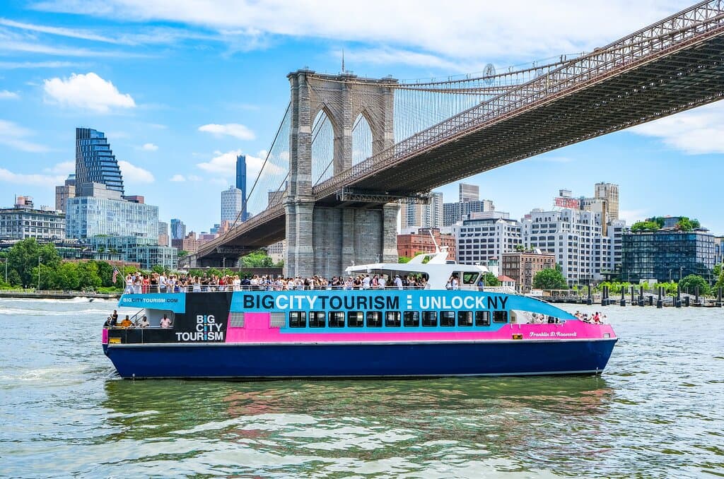 The Brooklyn Bridge and the Freedom Liberty Tour boat.