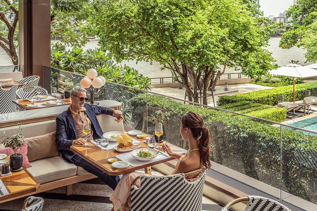 Riva del Fiume offers modern Italian dishes with river views, a show kitchen, and an intimate open-air terrace with Chao Phraya River views.