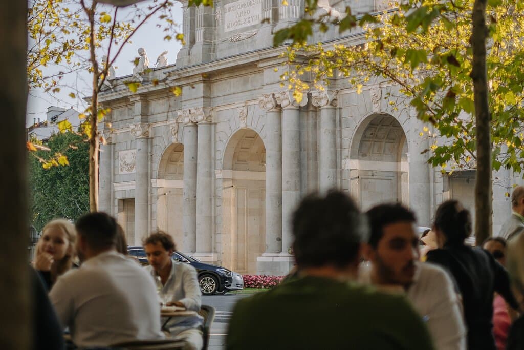 Where every sip comes with a view — the Puerta de Alcalá from our terrace at Cappuccino Grand Café Madrid.