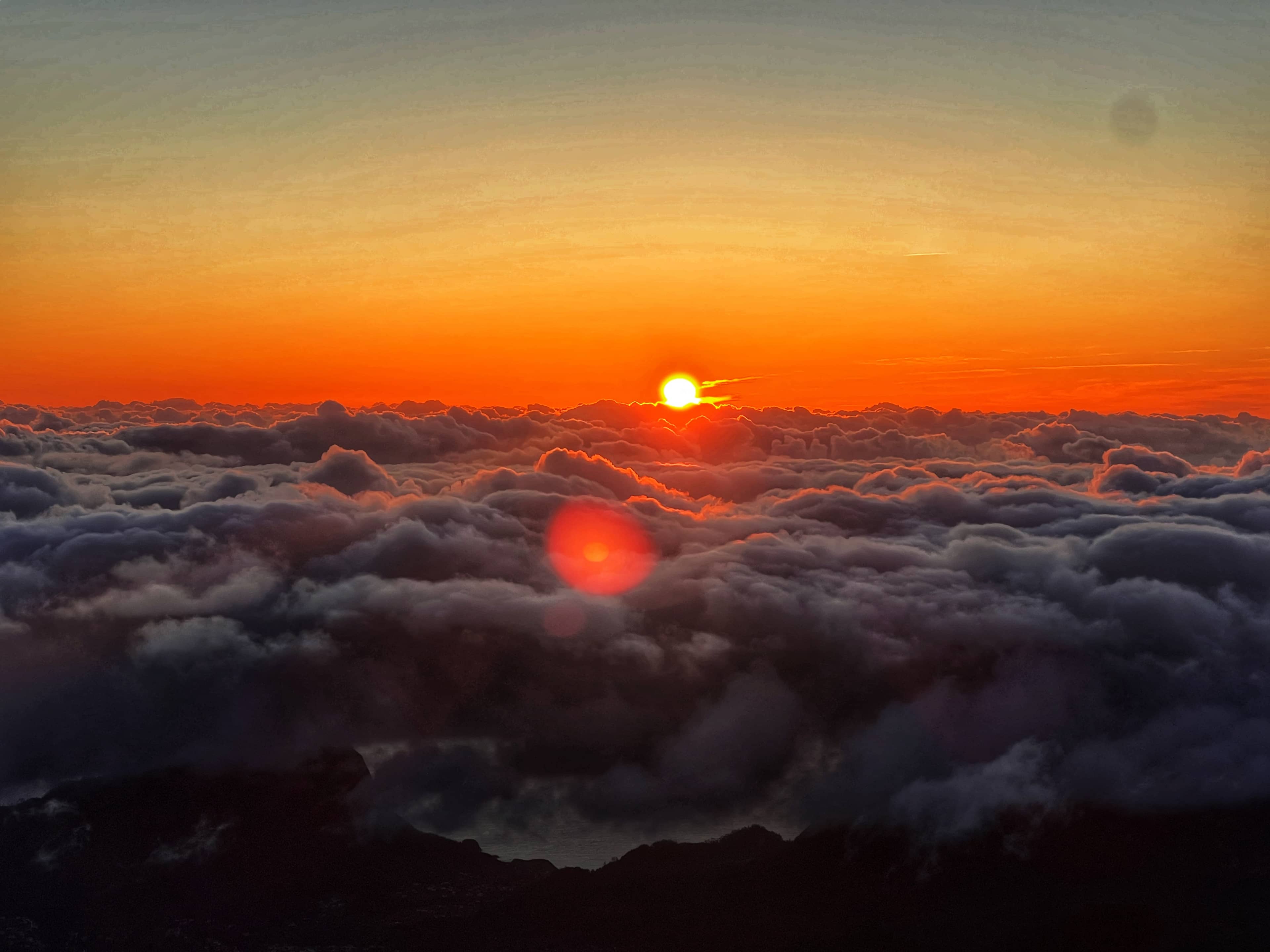 Sunrise Above the Clouds