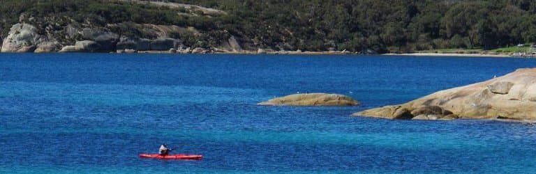 A kayaker at the eastern end of the beach
