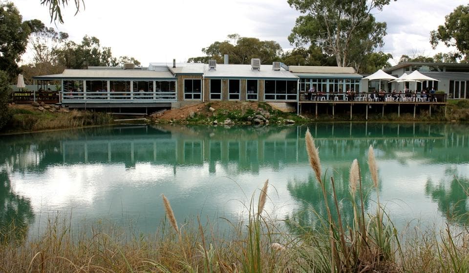 The shop and deck from the other side of the dam take the walk
