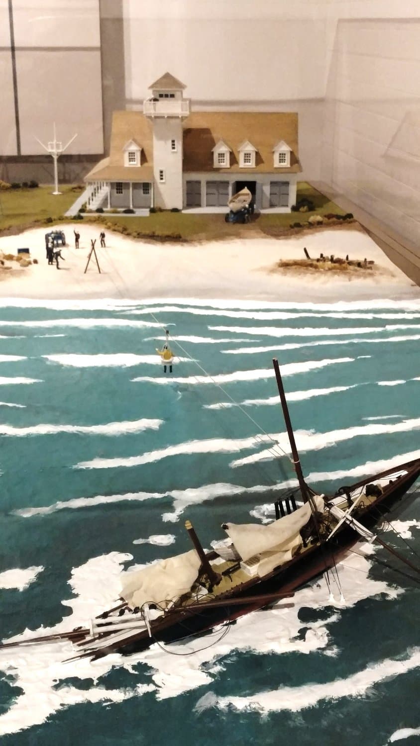 A model showing a rescue of people on a ship wrecked on a sand bar with a nice model of this mus