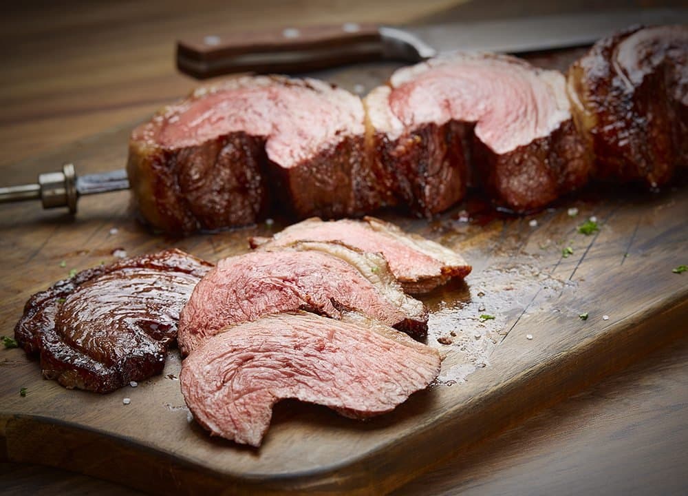 Picanha: Prime part of the Top Sirloin. Lightly seasoned with rock salt & sliced thin