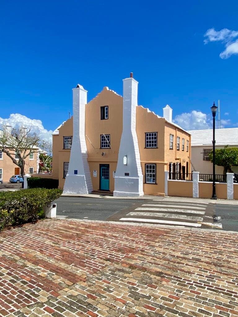 You will find Globe directly across from St. Peter's Church and on the corner of King's Square in St. George's.