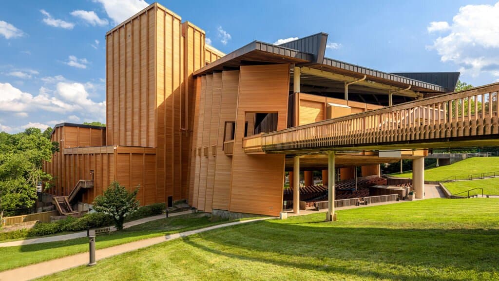 Just 15 miles from Washington, DC, the Filene Center stands as the crown jewel of Wolf Trap National Park for the Performing Arts—the nation’s only national park dedicated to the arts. Set on 117 acres of protected parkland, this striking 7,000-seat amphitheater hosts 70+ performances every summer.