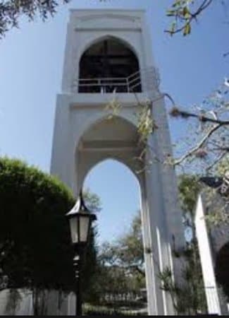 Bell tower to right of church