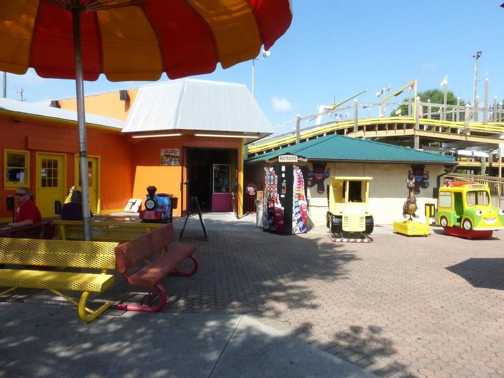 Shade seating, arcade, restrooms & coin operated rides Kids Country at the Track