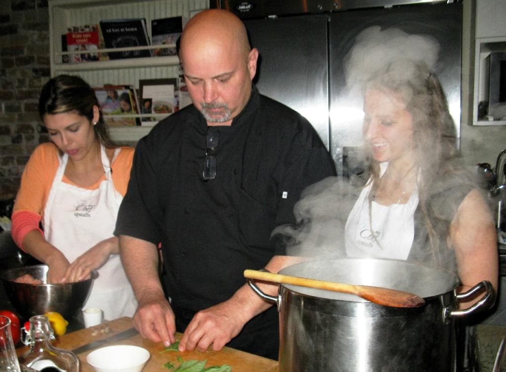 Chef Rene instructs the class
