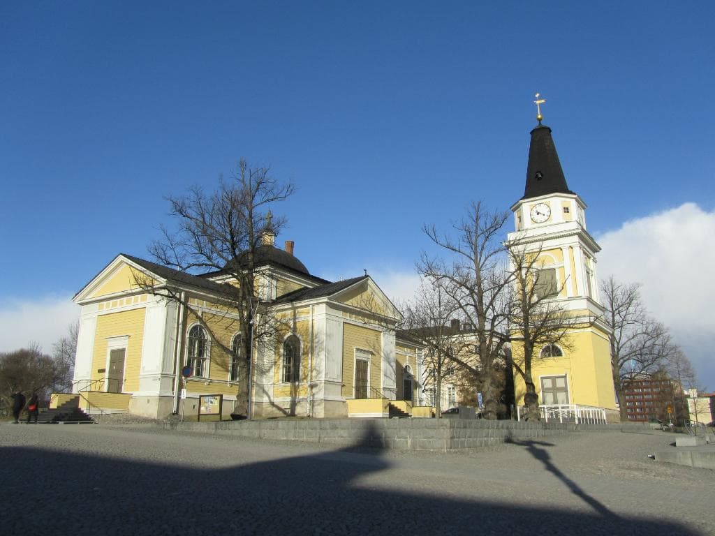 Beautiful church and bell tower beside Keskustori
