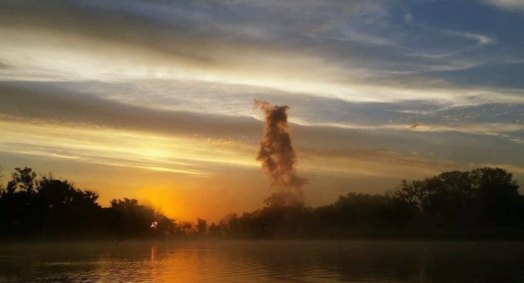 sunrise canoeing on the wetlands marsh