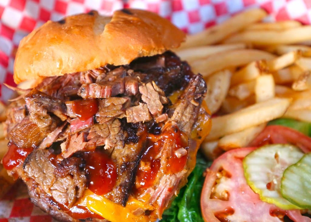 Brisket Cheddar Burger topped with BBQ sauce made from beer