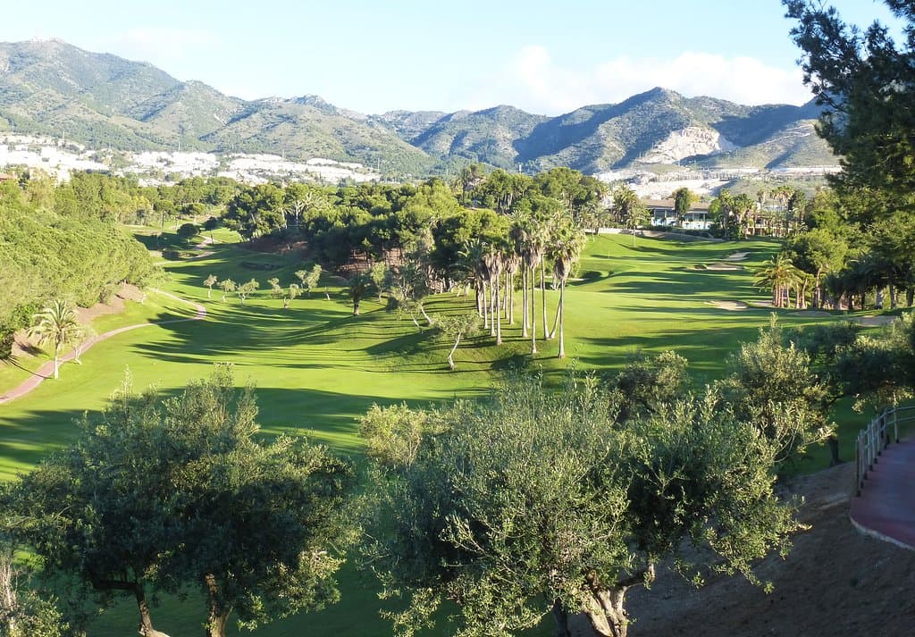 The beauty of the 6th and 18th fairway with the Clubhouse and mountains in the background.