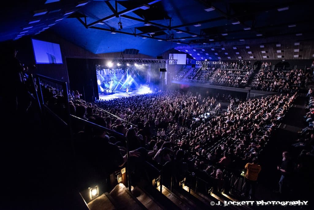 Our venue accommodates over 2,000 people seated, and 2,200 with a GA pit for large rock and country shows. The room can also be scaled down to 1,100.
When the facility is hosting trade shows and business expos, or hosting a nightclub-style event, the seats are removed on the main floor and the balcony sections are raised, allowing the entire area to be used for display space, exhibits, or entertaining.