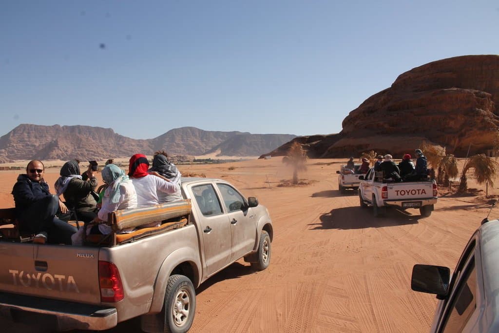 Wadi Rum Safari - some jeeps running fast on the sand.