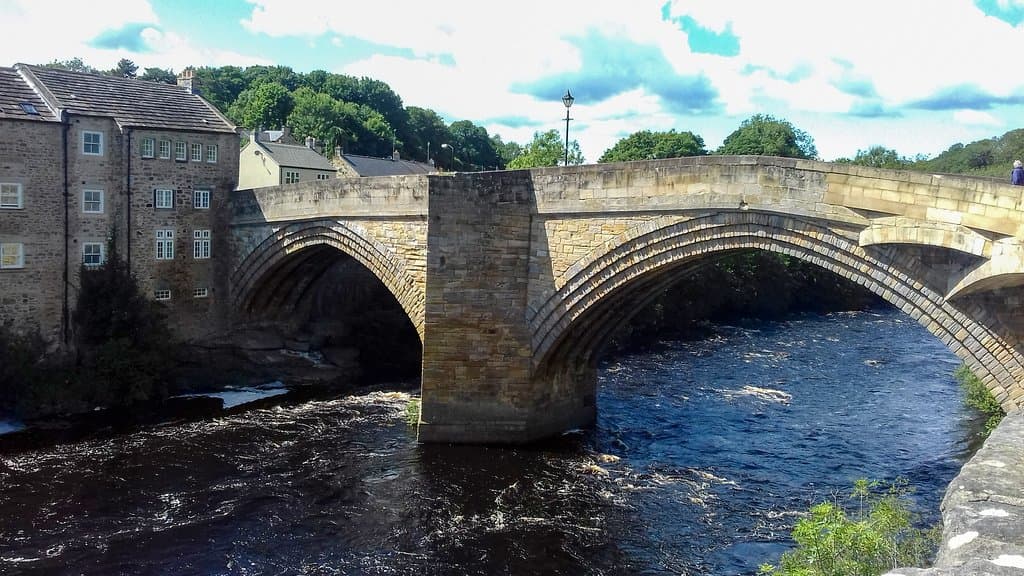The County Bridge from down river on the Barnard Castle side. The building adjoining it used to be for weavers but was for over a century the Swan Inn until it was turned into housing recently.