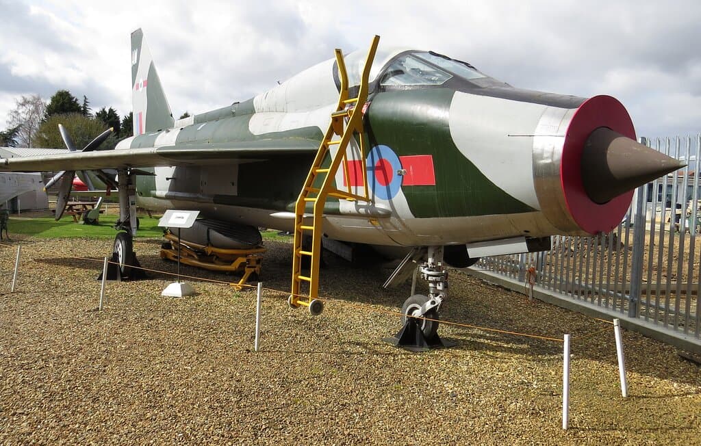This is our Lightning T5. It is a 2 seater that used to train pilots to move onto the single seat version. It is unusual in it's design as the 2 engines were set one on top of the other giving it it's distinctive shape. You can also make out the propeller of our full size replica spitfire in the background that is just waiting to have it's wings put back on.