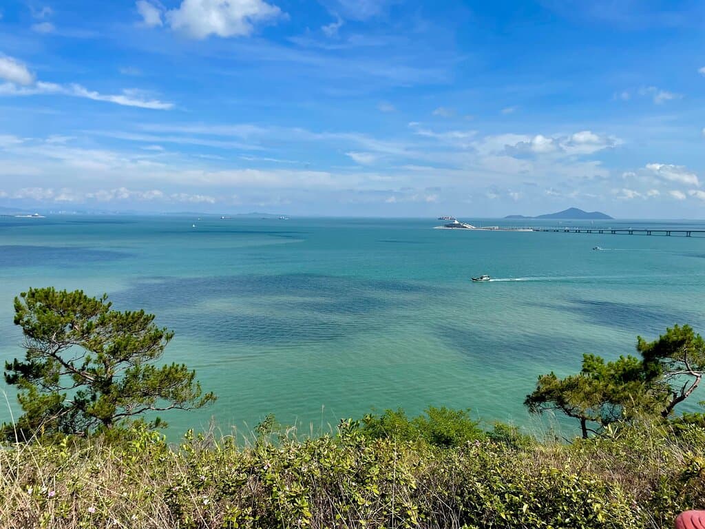 The Fu Shan Hiking Trail leads up to a panoramic viewing point at the top. From the ridge you can see Macau in the distance, the Hong Kong-Macau Bridge and look back down over the fishing village of Tai O. Occasionally people also see the very rare pink and white Chinese dolphins.