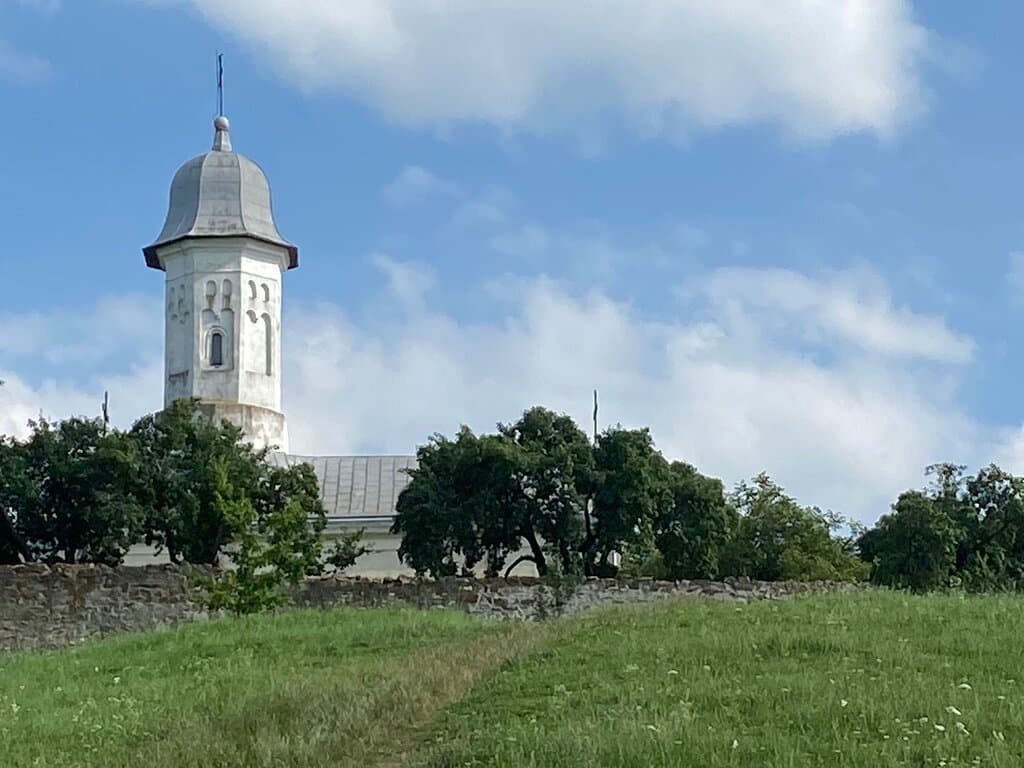 The church tower on the hill.