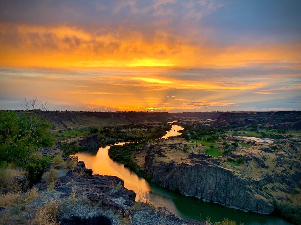 We happen to be driving through town and crossing the bridge at the perfect moment. A storm had just passed, so the sky was filled with clouds and beautiful colors. For just a couple minutes the bridge was a bright sunset red color.