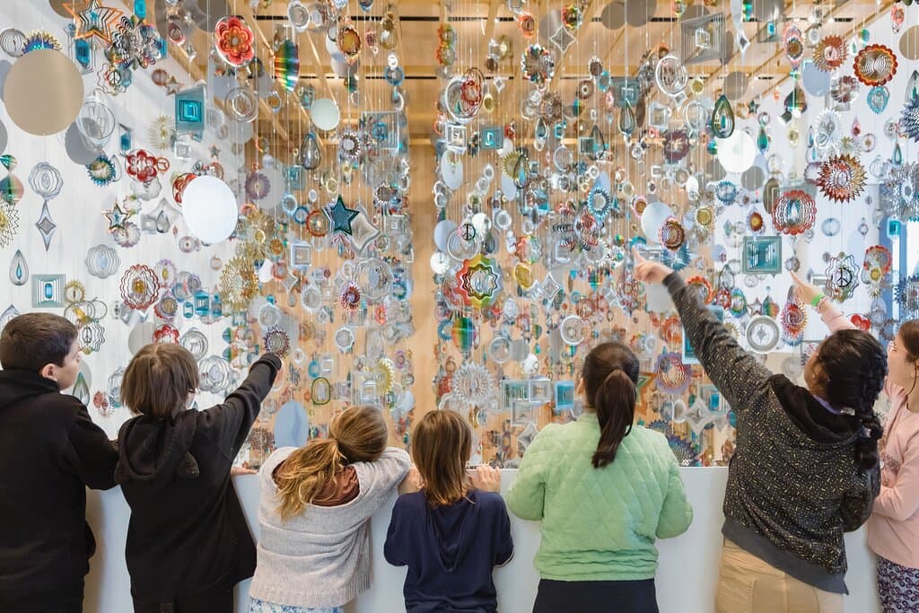 Children look at the work <i>Spinner Forest</i> by Nick Cave. Photo: Carey Shaw