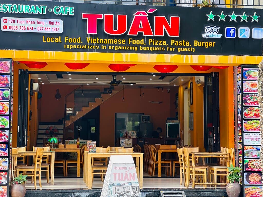 Nestled in Hoi An's vibrant ambiance, Tuan Restaurant blends modern design with local color. We specialize in a vast array of traditional Vietnamese and Hoi An specialties, notably our signature Cao Lau, as well as a selection of popular Western dishes. Each item is expertly prepared by our chef-owner, ensuring a unique, delicious experience. Committed to quality and safety, we use 100% fresh ingredients daily, maintaining strict hygiene standards. Tuan Restaurant stands as a culinary beacon in