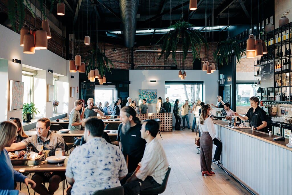 Guest in Bar, some just arriving while others order beverages